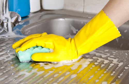 Professional cleaners removing construction debris from a newly built home